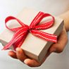 White box wrapped in red ribbon