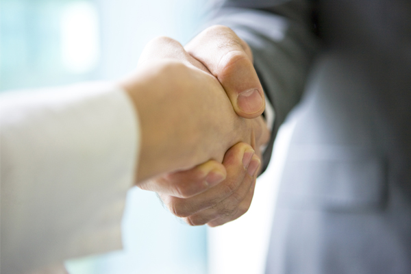 Two people shaking hands