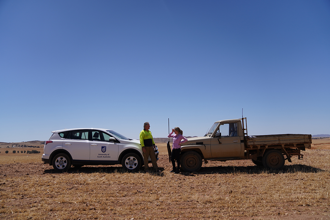 Dr Kate Gunn with a farmer in the field