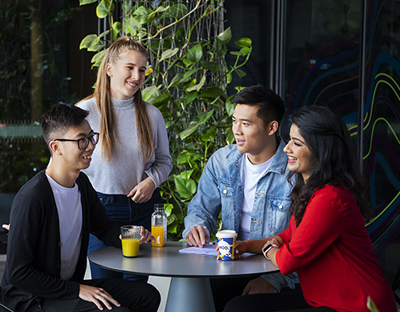 UniSA students chatting over refreshments outside