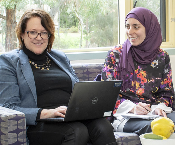 Professor Nicole Moulding with young woman in a hijab