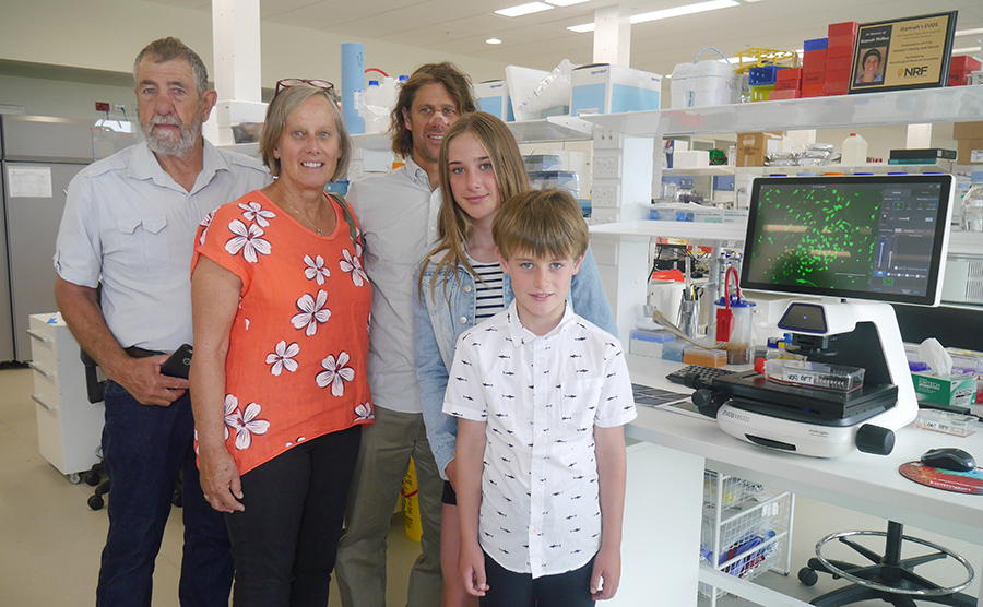 Hannah's family next to the new EVOS microscope